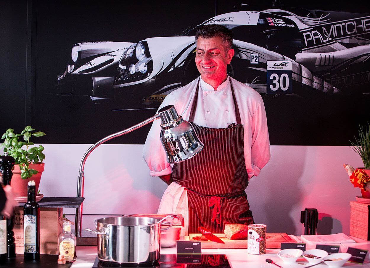 Cook waiting for guests at a buffet
